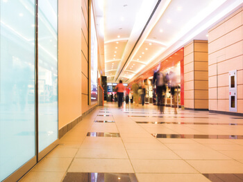 Interior view of people walking inside a mall